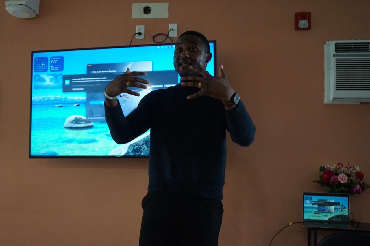 Maina presenting to students